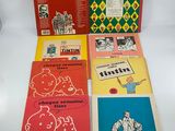 a group of five children ' s books sitting on top of a table