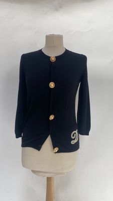 navy blue jacket with gold buttons on a mannequin base