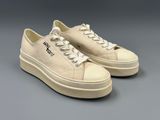 a pair of white sneakers with the word hell on them