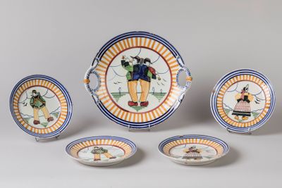 several plates and bowls with designs on them on a white surface