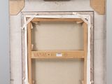 painting on an easel with a wooden frame and a white background