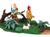 a figurine of a man and a woman in a forest