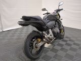 a motorcycle that is parked on a checkered floor