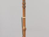 an image of a wooden instrument on a clear surface