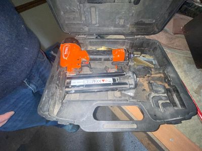 someone is holding a tool case with tools inside of it