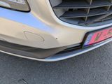 a close up of a car ' s grille with a number plate on it