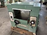 a machine that is sitting on a pallet in a warehouse