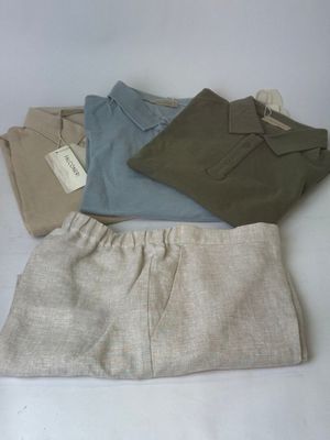 four pairs of men ' s clothing laid out on a white surface