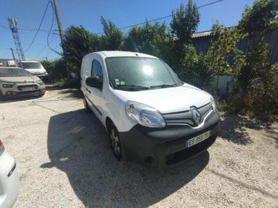 a white van that is parked on the side of the road