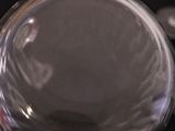 a close up of a glass object on a table