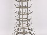 a metal wine rack that has a lot of bottles in it