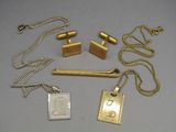 a lot of gold and silver items on a table