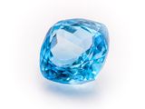 a close up of a blue diamond on a white background