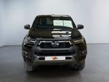 the front end of a black toyota rav parked in a garage