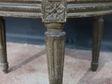 a close up of a chair with a floral upholstered seat
