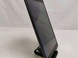 a close up of a tablet on a stand on a white surface