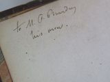 a piece of paper with writing on it sitting on a table