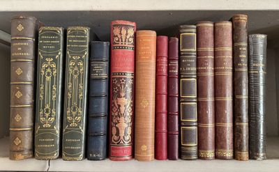 many old books on a shelf in a book case