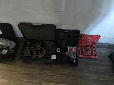 many tools that are sitting on the floor next to each other