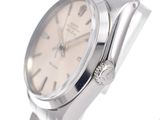 an image of a close up of a wrist watch on a white surface