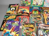 a lot of comic books that are on the table
