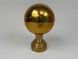 a gold ball on a gold pedestal on a white background