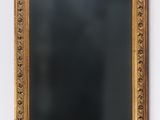 a mirror hanging on the wall in a room