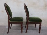 two chairs that are sitting next to each other