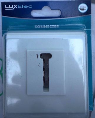 a white light switch in a package on a table