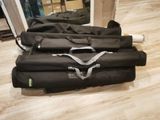 four bags of luggage sitting on the floor next to each other