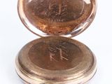 an old pocket watch with a chain around it