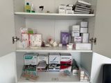 a cabinet with a lot of medical supplies on it