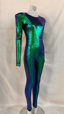 a green and blue bodysuit on a mannequin stand