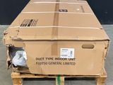 a cardboard box sitting on a pallet in a warehouse