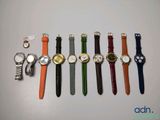 a lot of watches that are lined up on the table