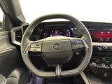 the interior of a car with a steering wheel and dashboard controls