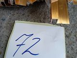 a picture of a piece of wood with a sign attached to it