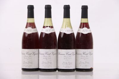 three bottles of wine sit next to each other on a table