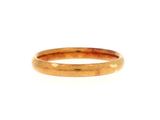 a close up of a gold ring on a white background