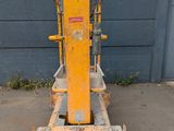 an image of a forklift sitting in front of a building