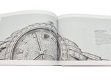 an open book with a drawing of a watch on it