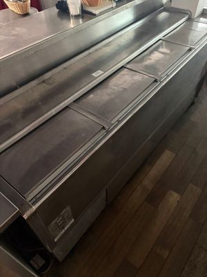 a conveyor belt in the middle of a kitchen