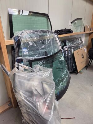 a pile of luggage sitting on the floor next to a chair