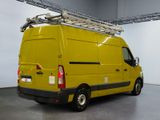 a yellow van that is parked in a garage