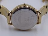 an image of a close up of a wrist watch on a white surface