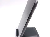 a cell phone that is sitting on top of a stand