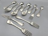 six forks and six spoons are arranged in a row on a table