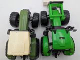two toy tractors that are sitting next to each other