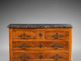 an antique chest of drawers with marble top