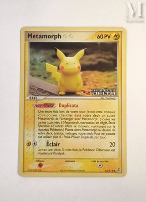 the pokemon card has a picture of a pikachu sitting on top of it